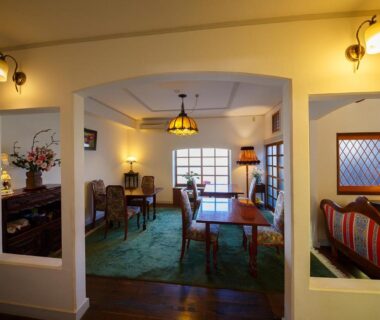 Cozy dining room with wooden table and vintage lamps at Kannomori, Ōita, Kyūshū, Japan