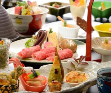 Assorted traditional small-plate Japanese dishes arranged for a ryokan meal
