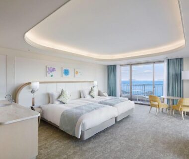 Spacious twin room with balcony overlooking the sea at Karatsu Seaside Hotel in Saga prefecture