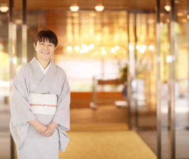 Woman in kimono welcoming guests at Kashoen lobby in Iwate, Tōhoku