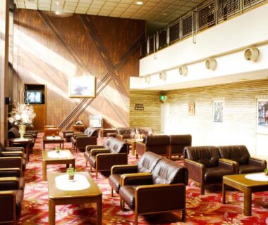 Spacious lounge area with sofas and wooden accent wall at Kasugai View Hotel, Yamanashi, Chubu Japan