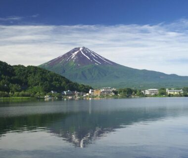 Mount Fuji reflected on calm lake near Kasuitei Ooya in Yamanashi, Chūbu, Japan
