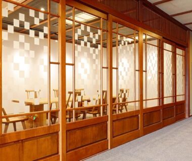 Interior corridor with shoji panels and seating at Katsuzakikan in Ishikawa, Chūbu, Japan