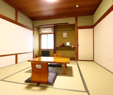 Traditional tatami room with low table and zabuton at Kawachiya Ryokan in Mie, Kansai