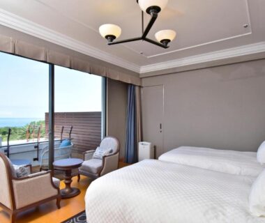 Twin beds and balcony with sea view at Kawana Hotel in Shizuoka, Chubu