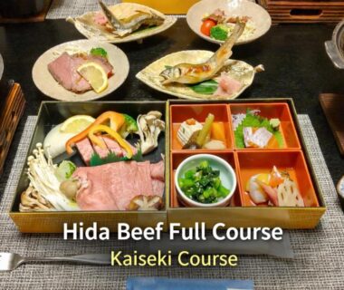 Kaiseki spread featuring Hida beef slices and assorted seasonal dishes in traditional Japanese tableware at Kazeya, Gifu
