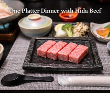 Marbled Hida beef slices on a black platter with side dishes at Kazeya in Gifu, Chūbu, Japan