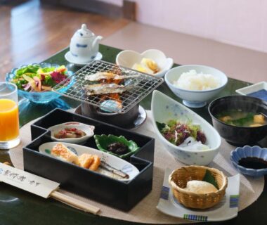 Breakfast spread with grilled fish, rice and miso soup at Keishokan Sazanamitei, Hiroshima