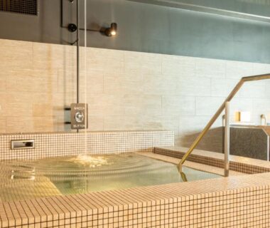 Interior tiled bathing pool with handrail at Kiki Shiretoko Natural Resort, Hokkaidō