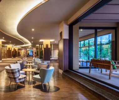 Spacious lounge with armchairs and tatami style seating at Kiki Shiretoko Natural Resort Hokkaido