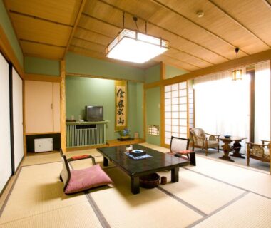 Tatami room with low table, zabuton cushions, shoji screens at Kikori Ryokan in Yamanashi, Chūbu, Japan
