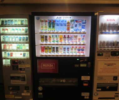 Three illuminated vending machines in hotel corridor at Kikuchi Kanko Hotel, Kumamoto, Kyūshū, Japan
