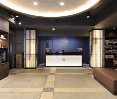 Reception desk with tatami flooring and shoji lamps at Kikunoya ryokan in Hiroshima, Chūgoku