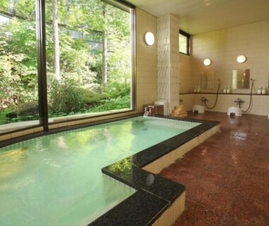 Indoor communal onsen with large garden-facing window at Kimimachisou, Nagano, Chūbu Japan