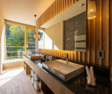 Bright bathroom vanity with sink and balcony view at Kinnotake Tonosawa, Kanagawa, Kantō