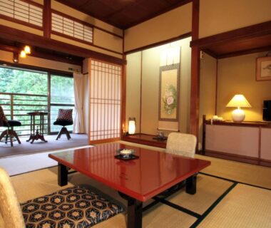 Tatami room with low lacquered table, shoji screens and balcony seating at Kinokuniya Ryokan in Kanagawa Kanto