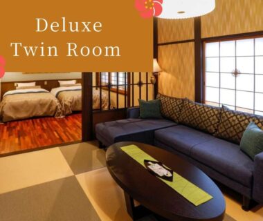 Tatami seating area with sofa and shoji screens, twin beds in adjoining room at Kinosaki Tenboen, Hyōgo, Kansai