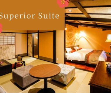 Tatami room with low table, Western beds, shoji screens and warm lighting at Kinosaki Tenboen, Hyōgo