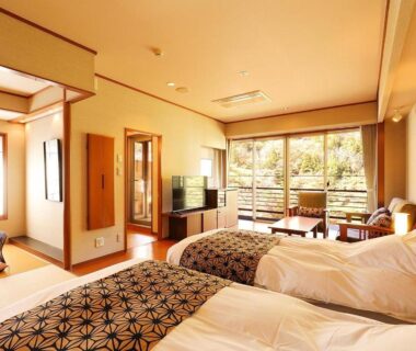 Ryokan room with twin beds, tatami seating and balcony garden view at Matsuya in Kinugawa Onsen, Tochigi