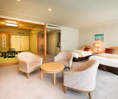 Room with tatami area, twin beds and seating at Kinugawa Onsen Sanraku, Tochigi, Kantō, Japan