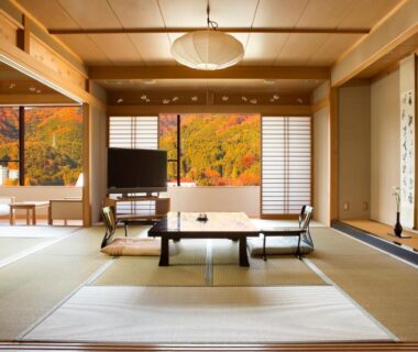 Spacious tatami room with low table and shoji screens, autumn foliage view at Kinugawa Onsen Sanraku, Tochigi