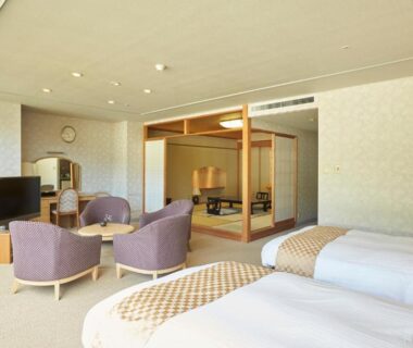 Twin beds and tatami seating area in Kinugawa Onsen Sanraku, Tochigi ryokan room interior