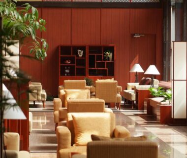 Lobby with armchairs, lamps and wood paneling at Kinugawa Plaza Hotel in Tochigi, Kantō