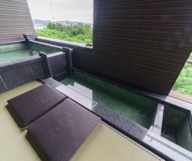 Outdoor stone baths on tatami terrace at Kisara Bettei TOKI, Mie with green hillside view