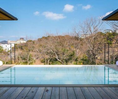 Wooden deck outdoor pool overlooking wooded hillside at Kisara Oneness in Mie, Kansai, Japan