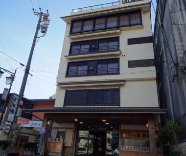 Multi-story ryokan exterior with wooden entrance and street frontage at Kisoya, Gifu, Chūbu