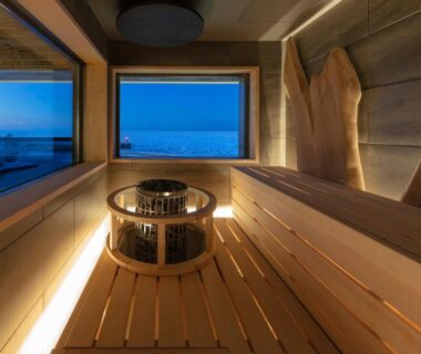 Wooden sauna interior with sea view windows at Kitakobushi Shiretoko Hotel, Hokkaidō, Japan