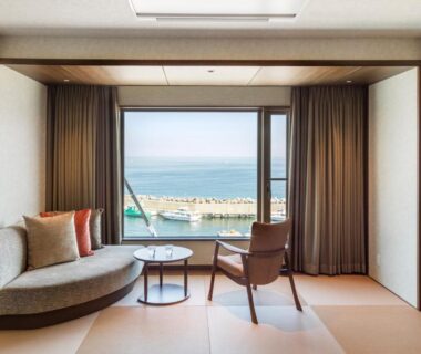 Tatami room with sofa and sea view at Kitakobushi Shiretoko Hotel & Resort in Hokkaidō Japan