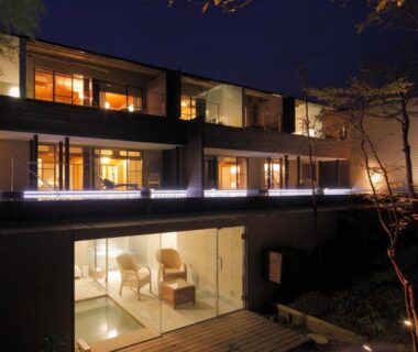 Nighttime lit exterior with glass-front rooms at Kitanokaze Saryo in Kanagawa, Kantō, Japan