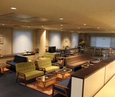 Spacious lounge with sofas and low tables at Kitashiga Holiday Inn in Nagano, Chūbu, Japan