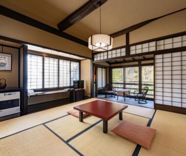 Tatami room with low table, shoji screens and garden view at Konashi No Yu Sasaya, Nagano