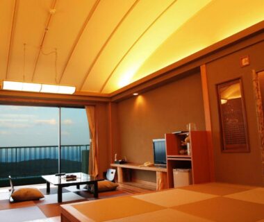 Tatami room with low table, cushions and balcony at Kounkaku, Fukushima