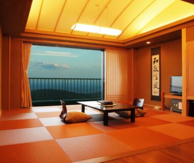 Tatami room with low table, cushions and waterfront view at Kounkaku, Fukushima, Tōhoku
