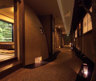 Lantern-lit corridor with shoji screens and tatami room visible at Kounkaku in Fukushima Tōhoku