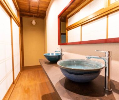 Two ceramic vessel sinks and shoji screens along wooden hallway at Koyasan Gokuraku Stay, Wakayama, Kansai