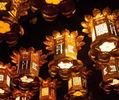 Hanging lanterns with warm glow in Koyasan Shukubo Jokiin interior Wakayama