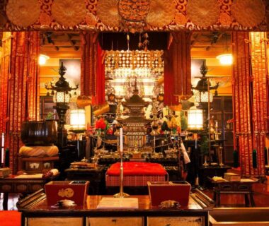 Interior temple altar with golden ornaments and lanterns at Koyasan Shukubo Jokiin in Wakayama