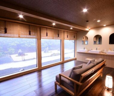 Wooden lounge with low sofa and large windows at Koyasan Shukubo Yochiin, Wakayama, Kansai