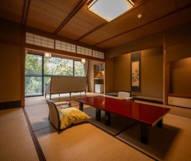 Tatami room with low lacquer table and zabuton cushions at Kuriya Yasohachi, Ishikawa
