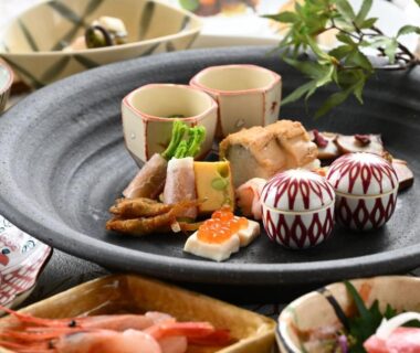 Assorted small Japanese dishes on ceramic platter at Kuriya Yasohachi, Ishikawa, Chubu