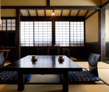 Tatami room with low table and shoji screens at Kurokawa Onsen Yama no Yado Shinmeikan, Kumamoto, Kyushu, Japan