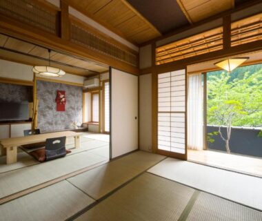 Tatami room with low table and shoji opening to garden view at Kurotake, Nagano, Chūbu
