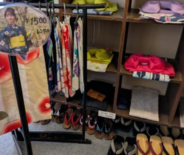 Yukata robes, geta sandals and folded garments in cubby storage at Kusatsu Onsen Eidaya, Gunma