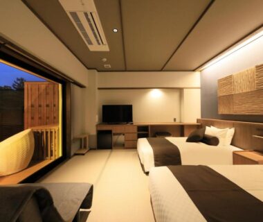 Tatami-style room with twin beds and balcony wooden tub at KusatsuOnsen AeruyadoTakamatsu, Gunma Kantō