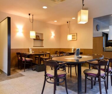 Ryokan dining area with wooden tables and lantern lighting at Ohara no Sato, Kyoto