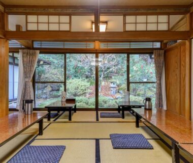 Tatami room with low tables and garden view at Kyo no Minshuku Ohara no Sato in Kyoto
